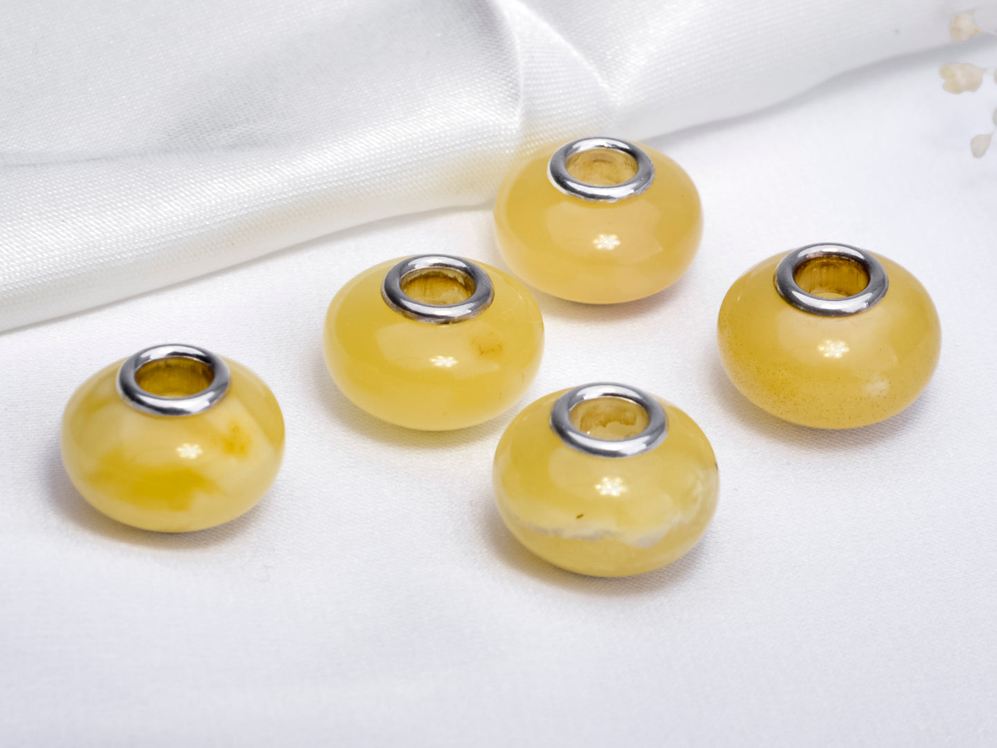 Distinctive Smooth Yellow and White Amber with Sliver Core Charms Bead