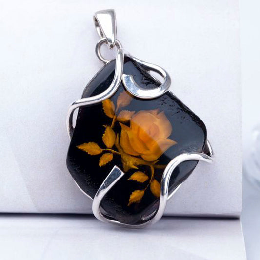 baltic amber pendant with flower carved