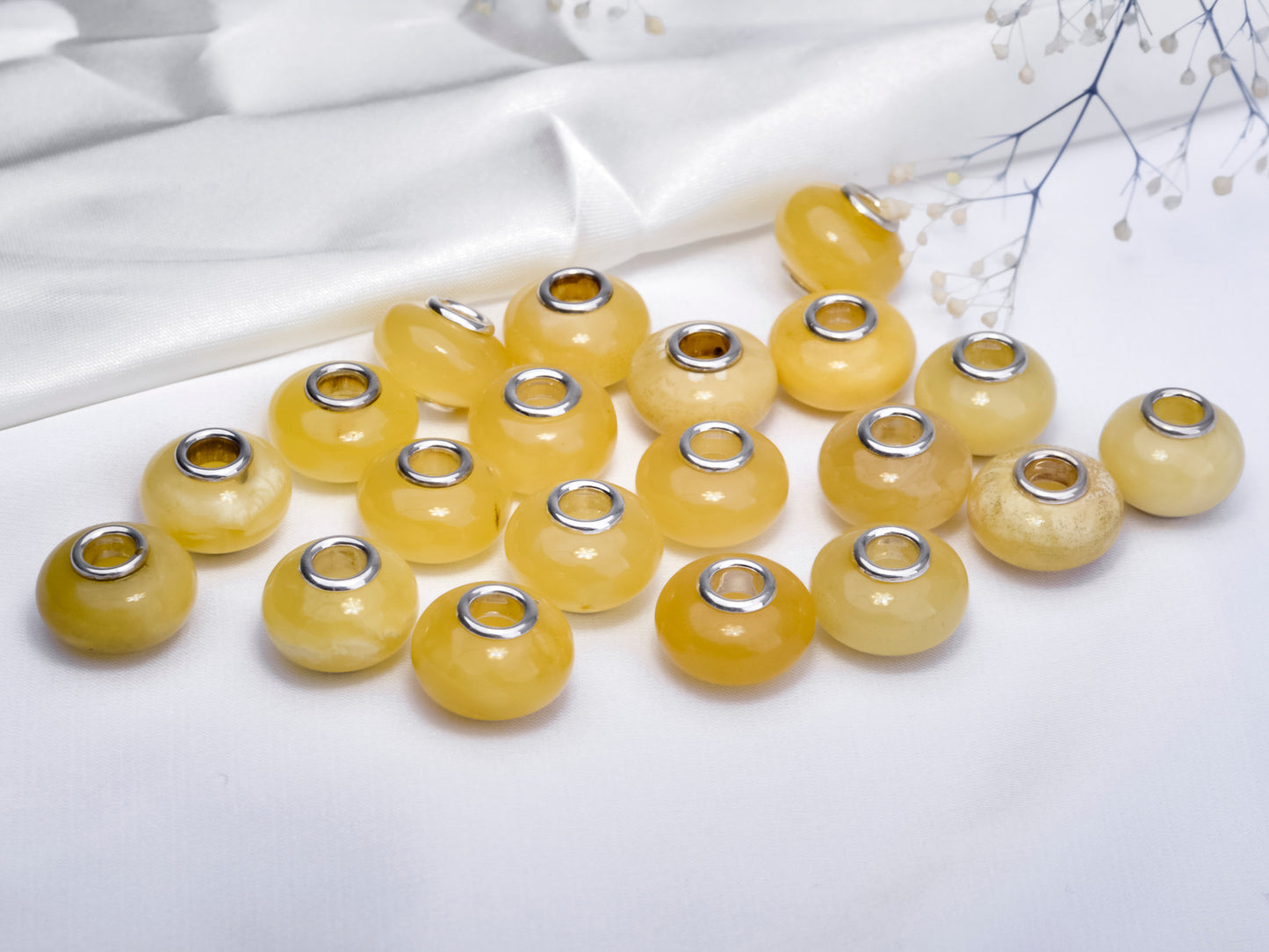 Distinctive Smooth Yellow and White Amber with Sliver Core Charms Bead
